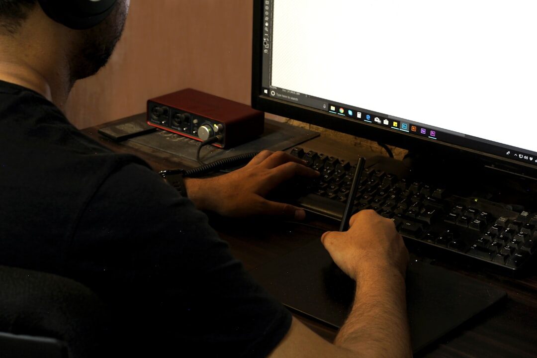 Video editor working on post-production at computer